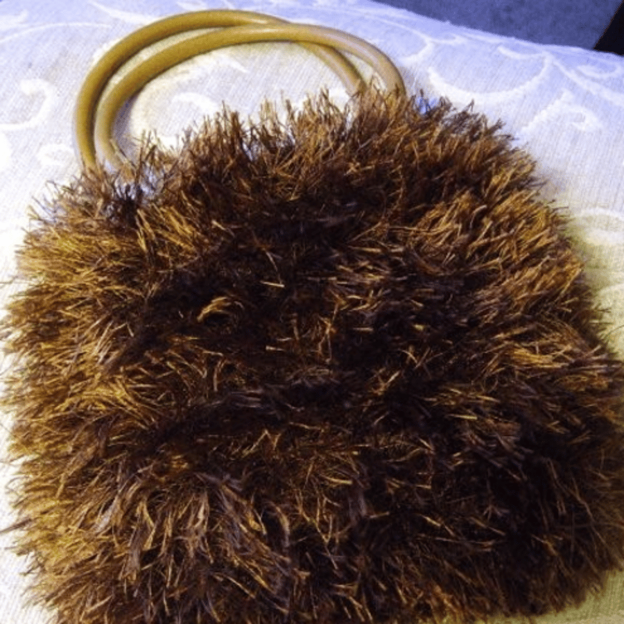 Funky Fluffy! A reversible handbag with round handles.