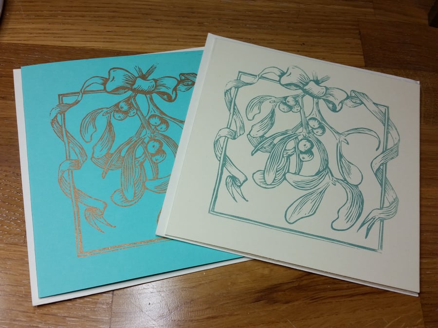 Handprinted linocut card mistletoe and ribbon. 2 colours available