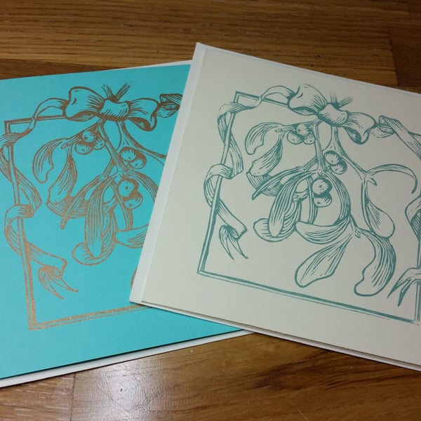 Handprinted linocut card mistletoe and ribbon. 2 colours available