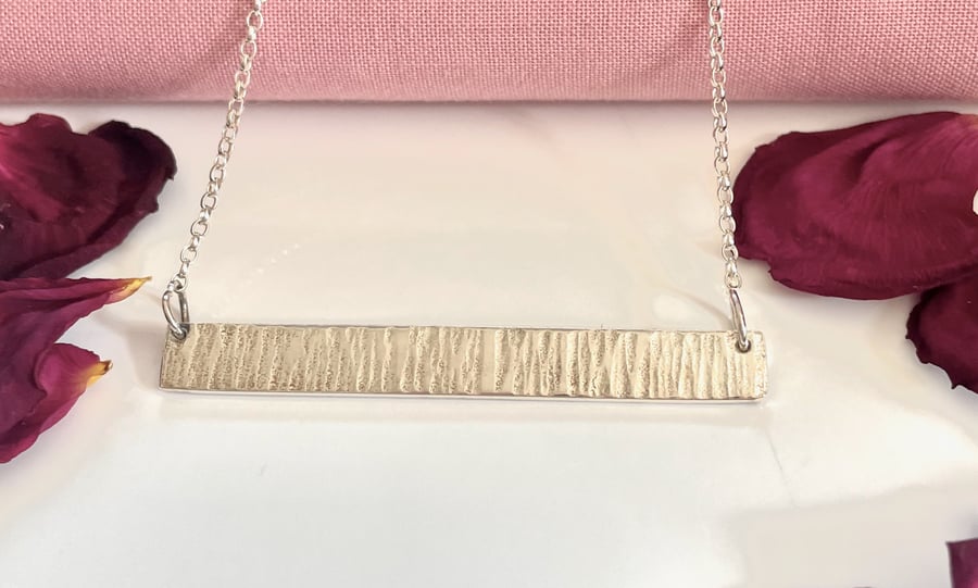 Solid hammered bar pendant 
