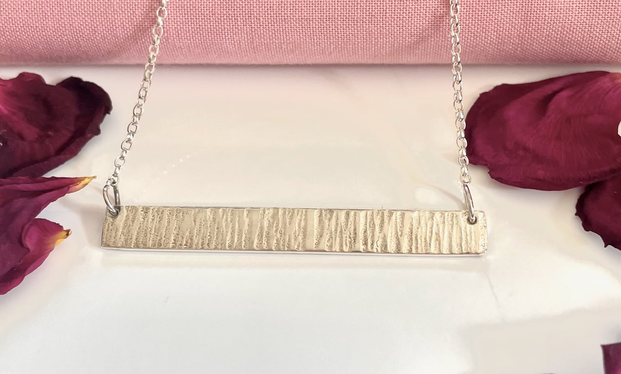 Solid hammered bar pendant 