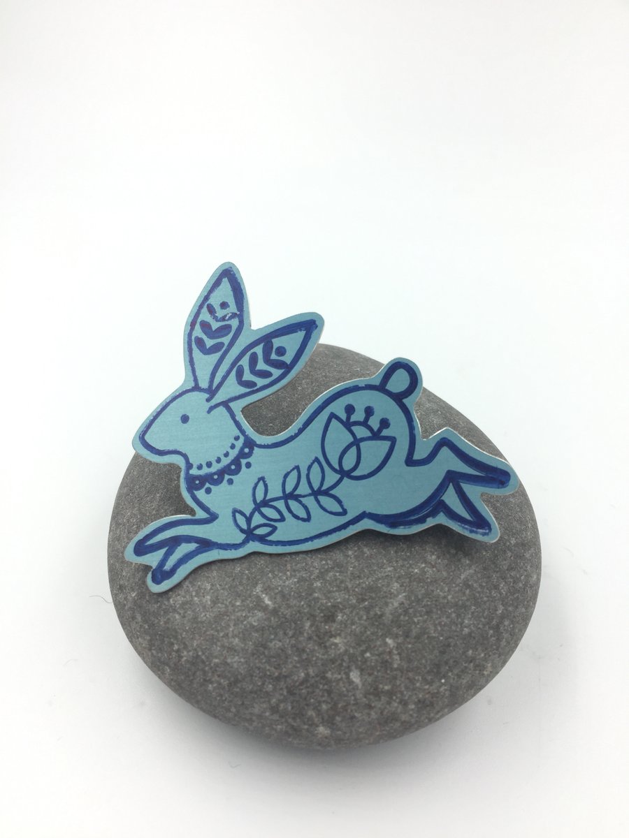 Pale teal anodised aluminium rabbit brooch.