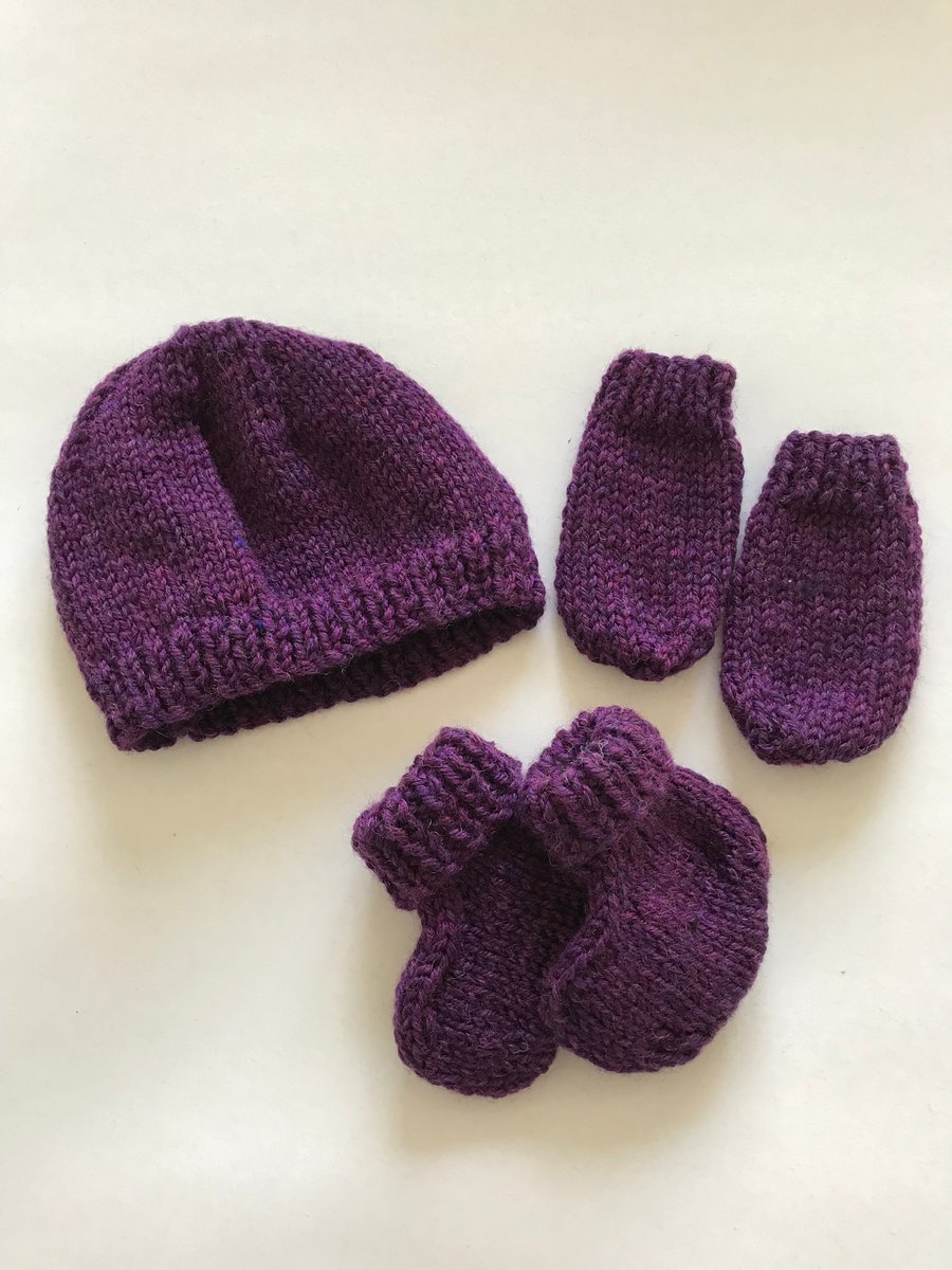 Hand knitted baby hat, bootees and mittens