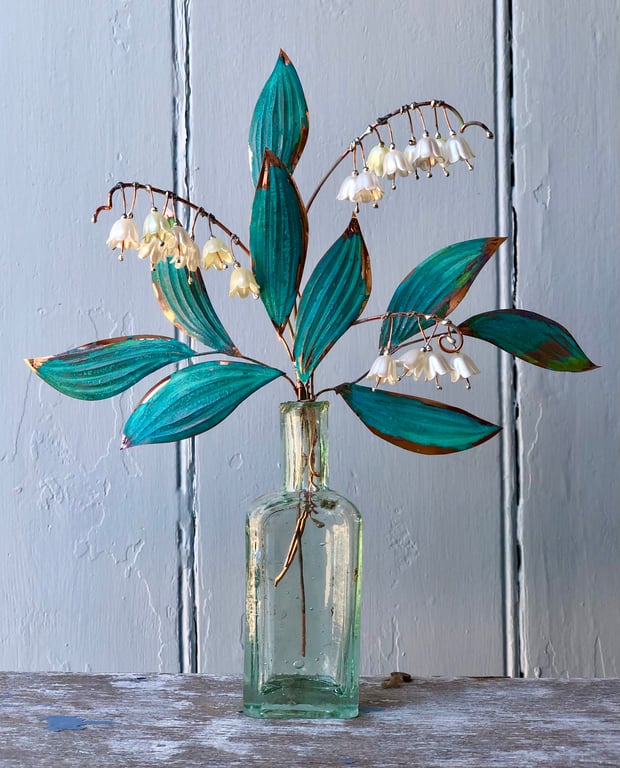 Lily of Valley in a vintage bottle