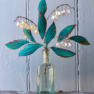 Lily of Valley in a vintage bottle