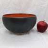 Orange and black ceramic bowl