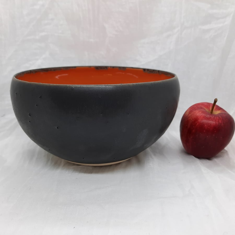 Hand made Burnt orange and black ceramic bowl
