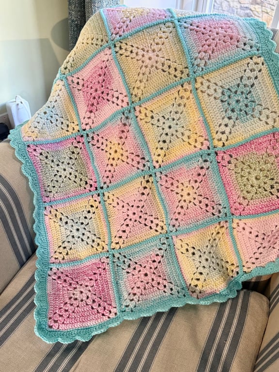 Bright and colourful cot blanket