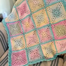 Bright and colourful cot blanket