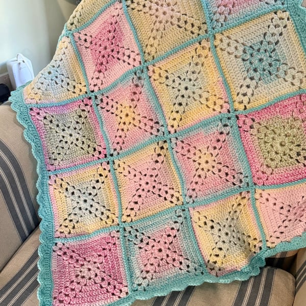 Bright and colourful cot blanket