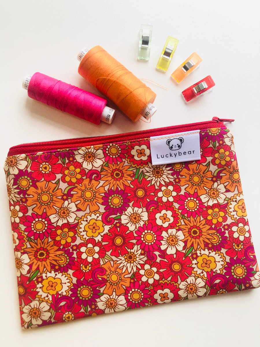 Bold vintage style floral print zip pouch in oranges, reds & pinks (small)