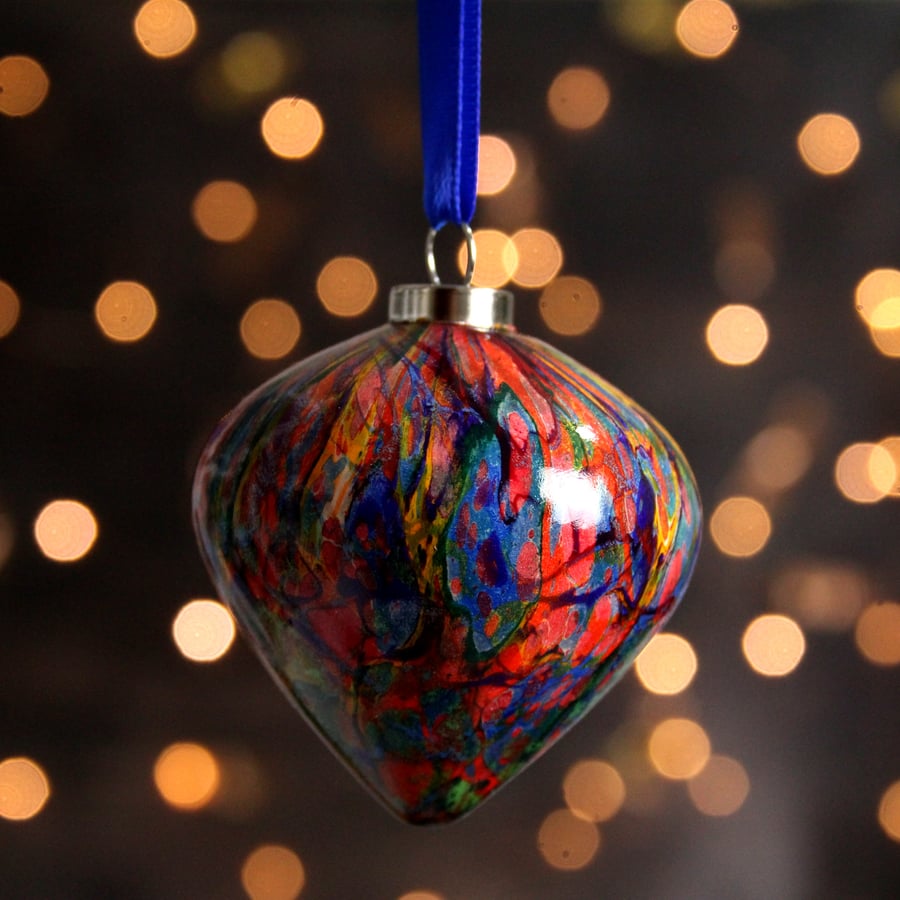 Colourful marbled pottery Christmas decoration in rainbow colours 