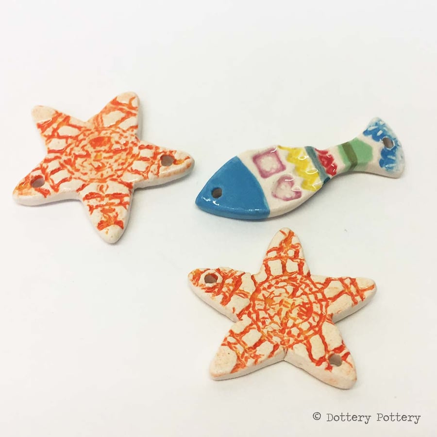 Ceramic starfish and fish beads suitable for jewellery making