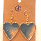 Heart shaped resin earrings filled with blue and gold resin