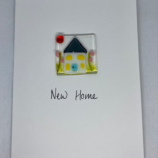 New home card with a fused glass panel featuring a little house and garden  