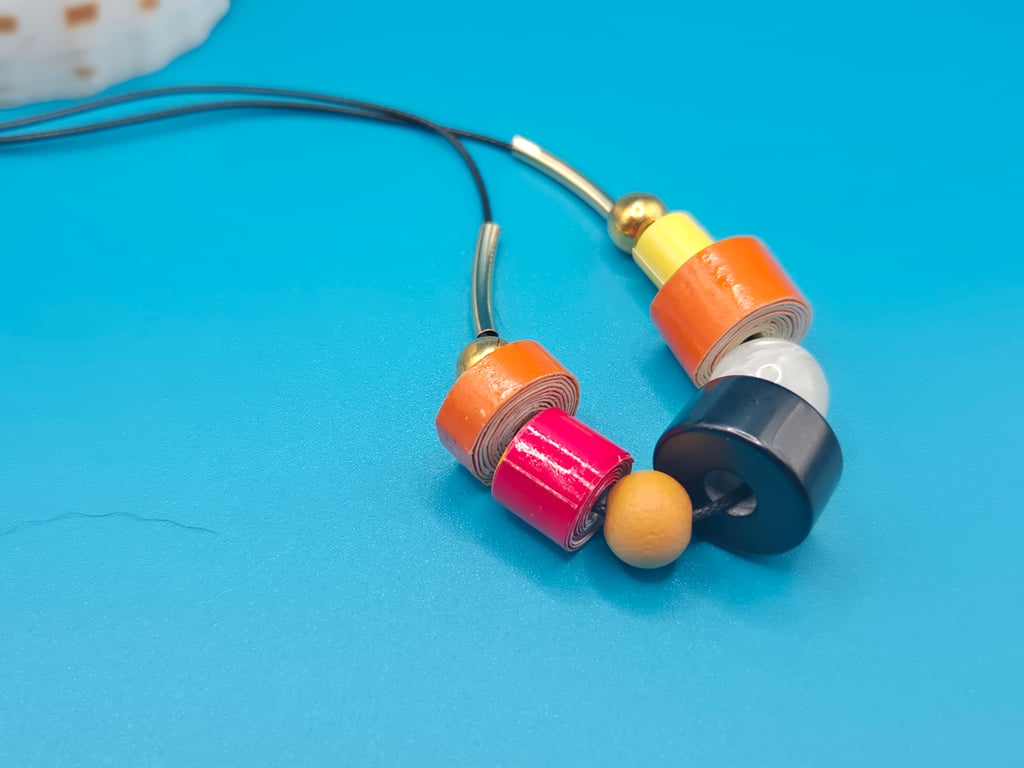 Fun and quirky paper beaded necklace on a cord