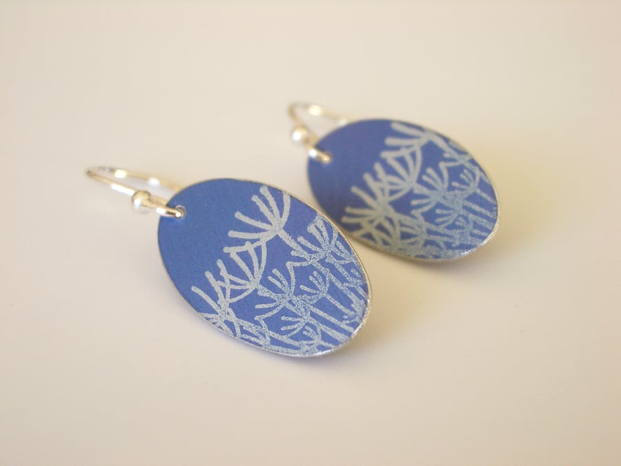 Blue oval earrings with dandelion seed print