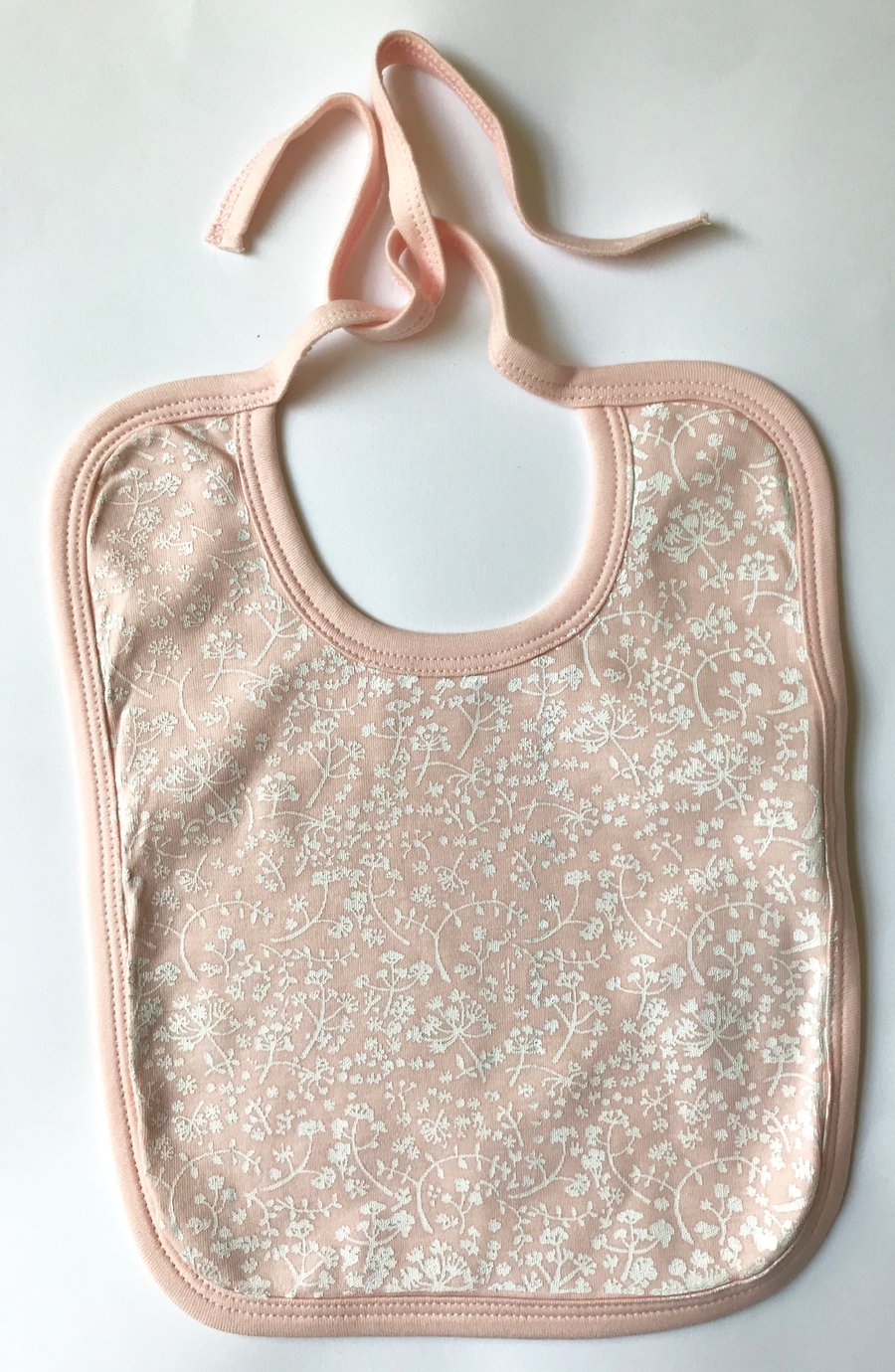Wild Meadow ditsy hand printed baby bib pink and white organic cotton bib