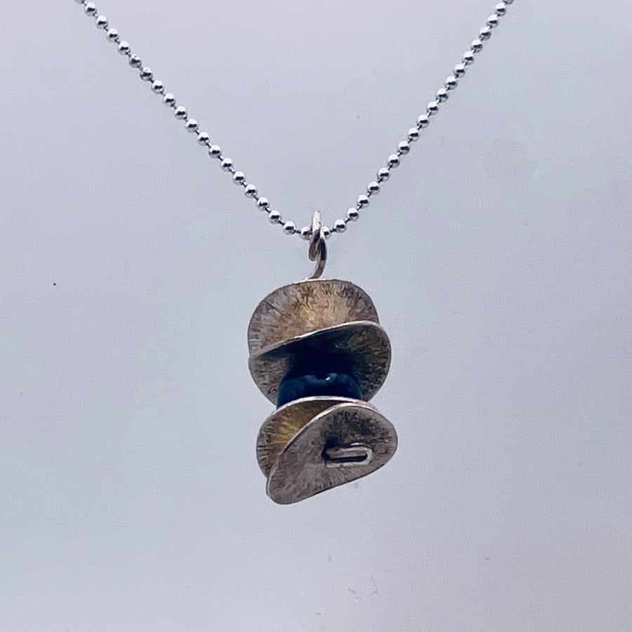 Bargain lapis lazuli blue and silver scratch disc pendant
