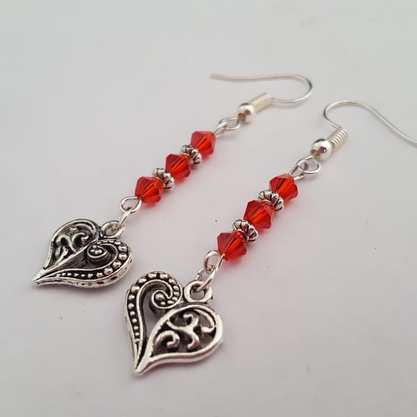 Silver filigree heart earrings with red glass beads
