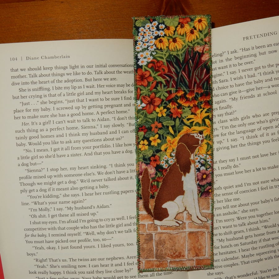 Bookmark brown and white dog in the garden
