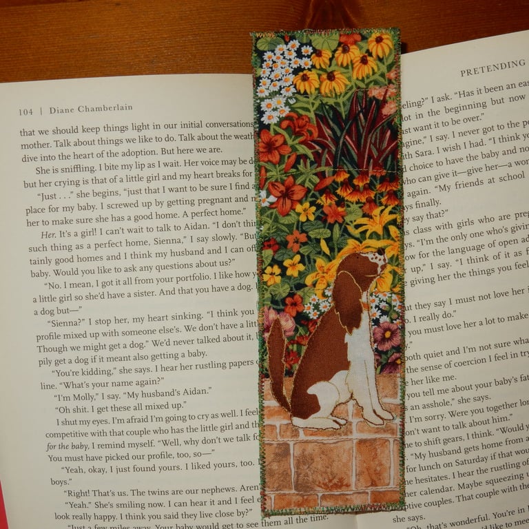 Bookmark brown and white dog in the garden