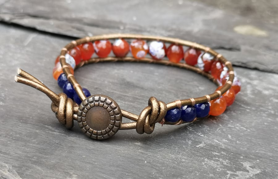 Bronze leather bracelet with orange and navy agate beads and button fastener 
