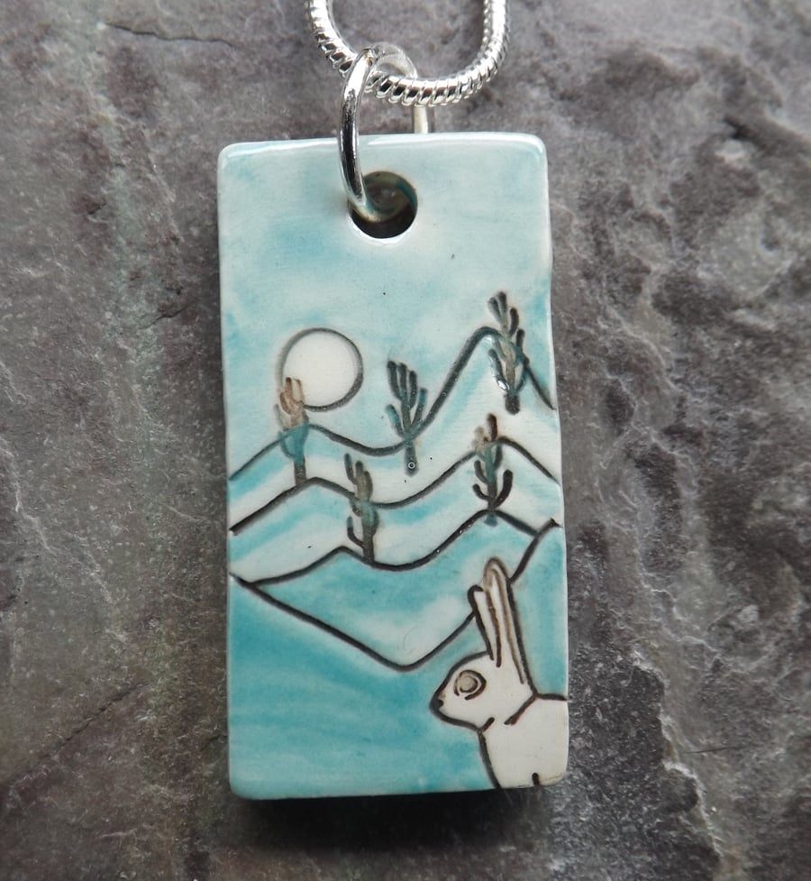 Handmade Ceramic Hare pendant in turquoise blue