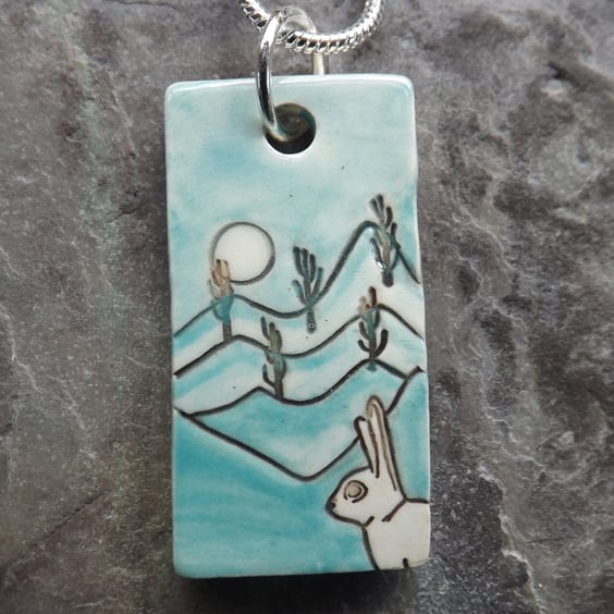 Handmade Ceramic Hare pendant in turquoise blue