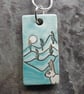 Handmade Ceramic Hare pendant in turquoise blue - Image 1