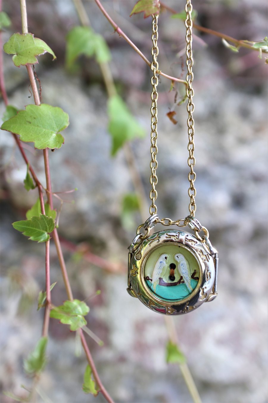 Upcycled gold tone vintage watch case decorated with LOVE birds necklace