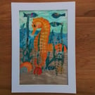 Textile picture of seahorse, fish and shells. 