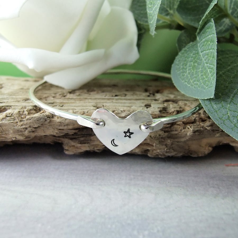 Silver Bangle. Bracelet with Centre Heart Stamped with Moon & Star. Size Medium