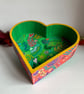 Brightly coloured hand painted heart dish