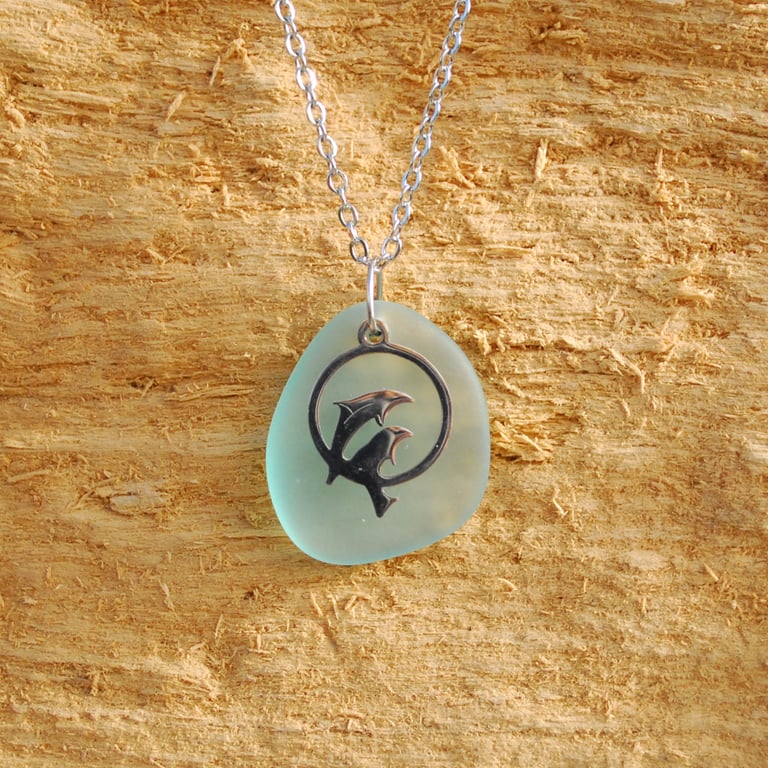 Dolphins on sea glass pendant