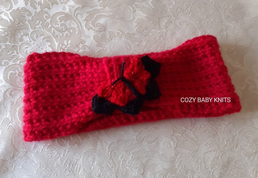 EARWARMER WITH A BUTTERFLY MOTIF