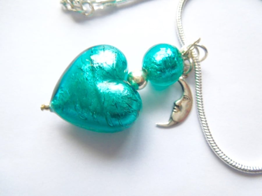  Murano glass green heart pendant with sterling silver charm and chain.