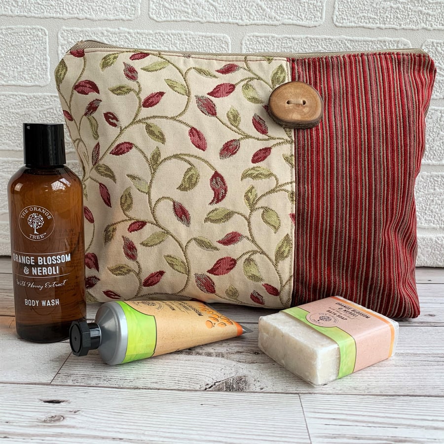 Woodland toiletry bag with leaf and stripes pattern and wood button