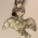 Raw silver Cormorant pendant