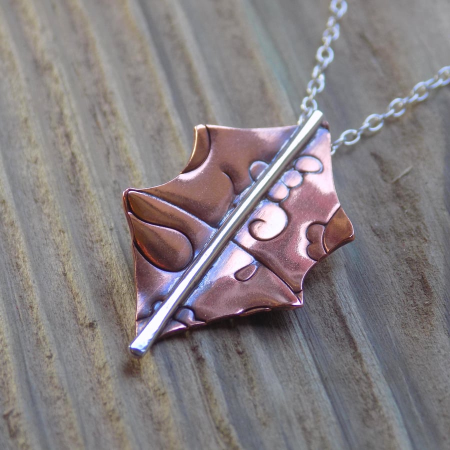 Copper holly leaf pendant with silver detail 