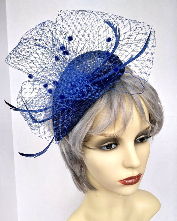 Pretty blue fascinator with veiling.