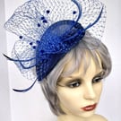 Pretty blue fascinator with veiling.