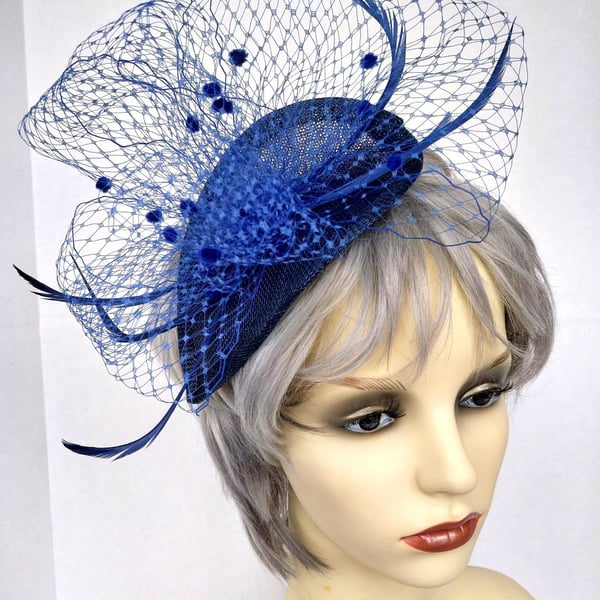 Pretty blue fascinator with veiling.