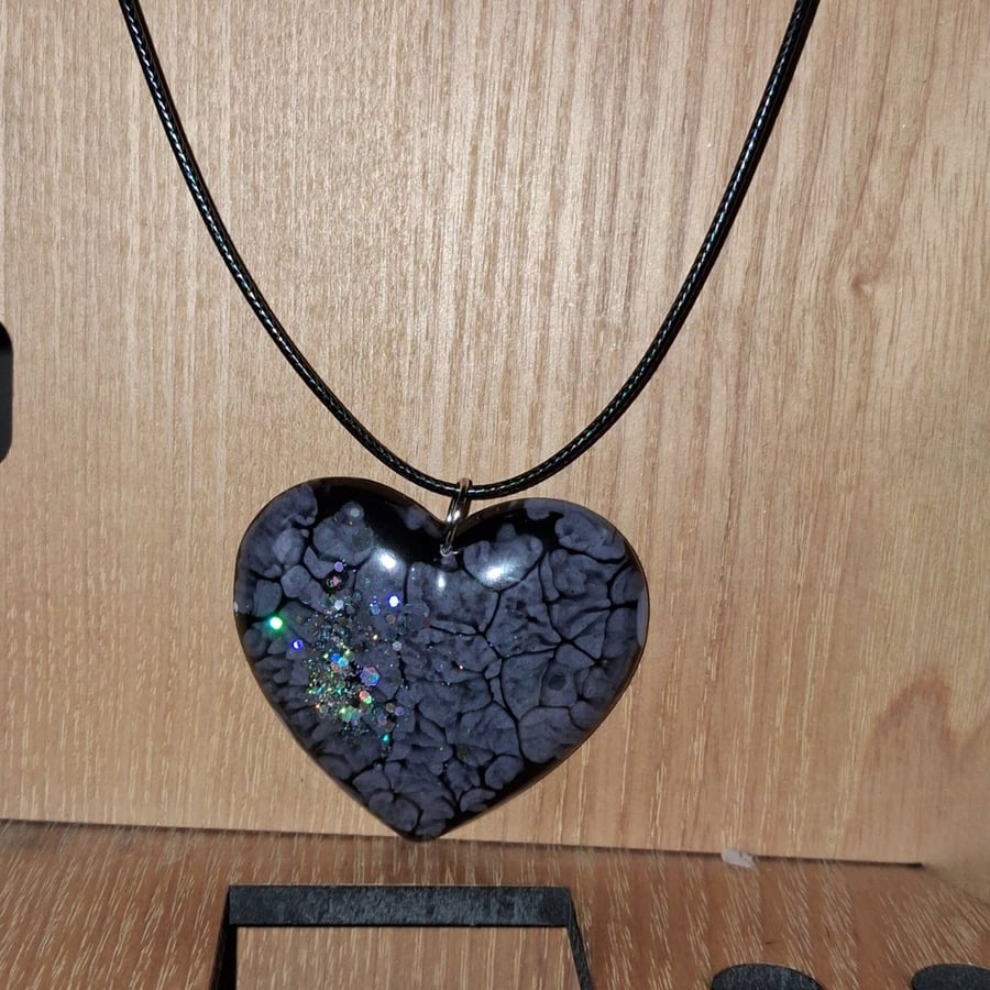 Handmade resin heart pendant on  black waxed cord