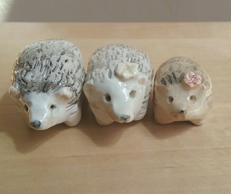 Handmade ceramic hedgehog figurine with yellow flower for lover of hedgehogs