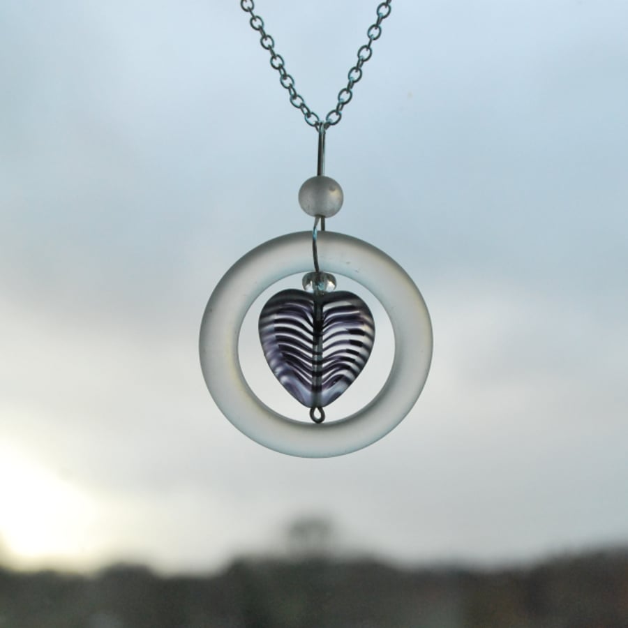 Glass ring pendant with heart