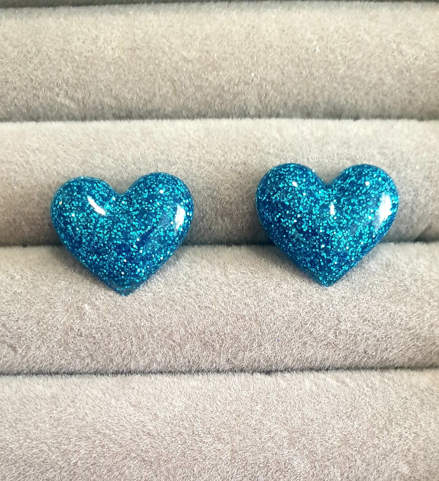 Small blue glitter heart stud earrings
