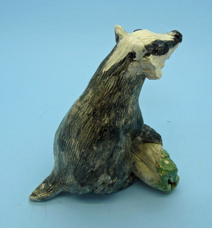 Ceramic Badger on log