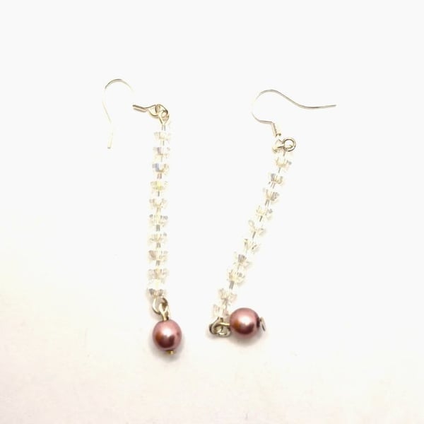 Handmade dangle earrings made with Swarovski crystals and faux pearls