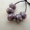 handmade purple and white spot lampwork glass beads